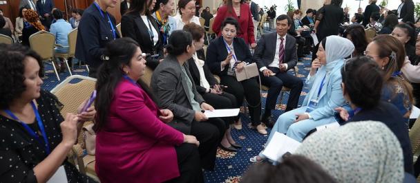 a group of people sitting in front of a crowd