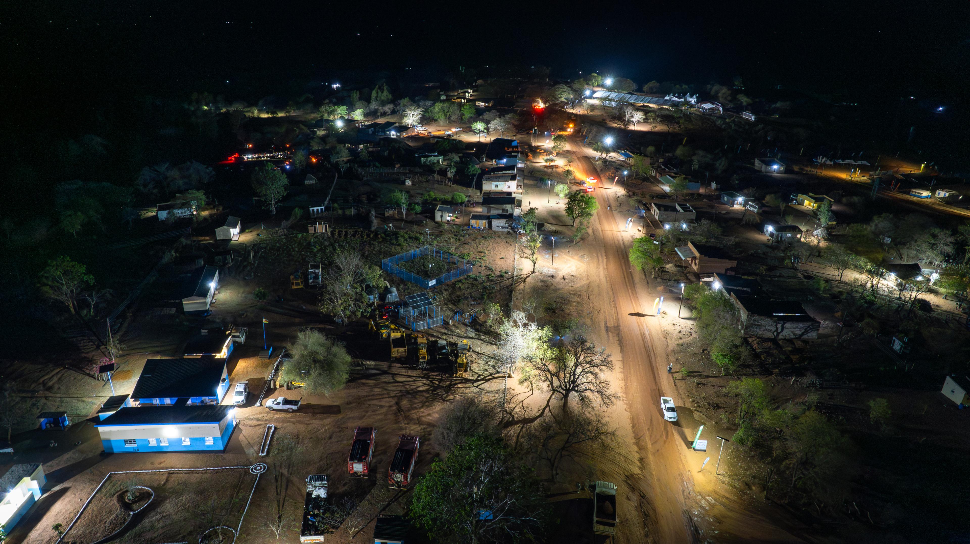 Aerial photo of a lit night scene in rural village