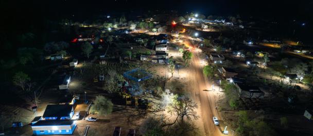 Aerial photo of a lit night scene in rural village
